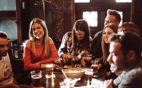 View of a group of friends drinking beer and having a good time