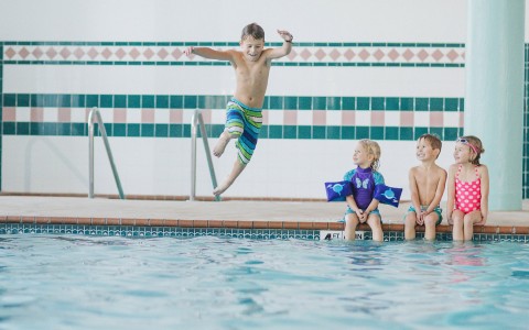 kids playing in an indoor pool