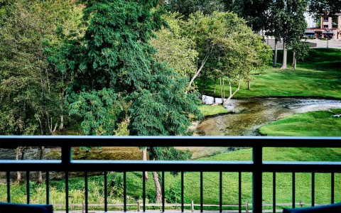 lush greenery and a stream overlooked from balcony