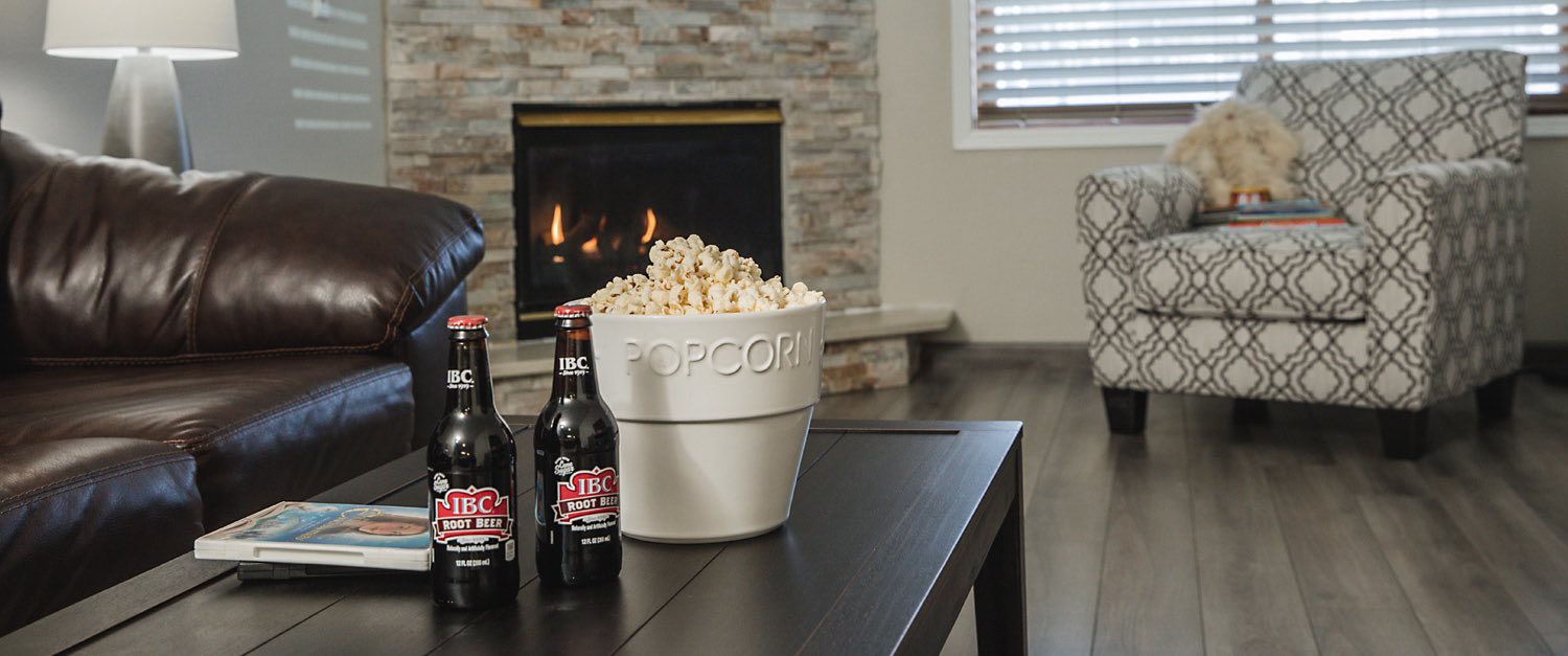 popcorn and coca cola on wooden table