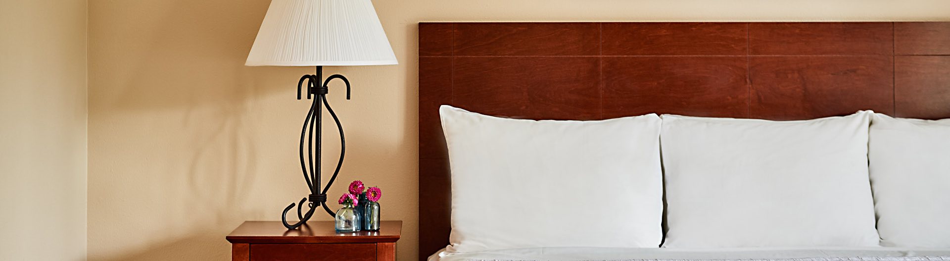 hotel bed with nightstand