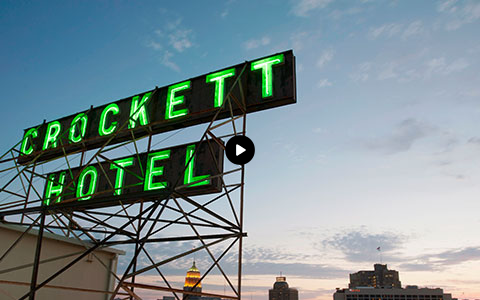 neon green crockett hotel sign