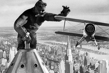 king kong reaching for an airplane