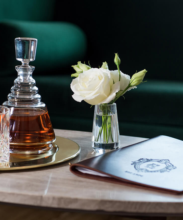 flowers and liquor on a table