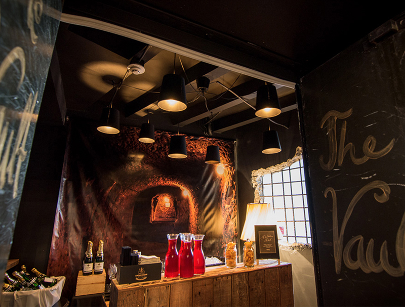 dark walls with drinks on a wooden table