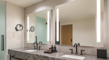 two bathroom sinks with mirror