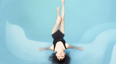 woman laying in pool