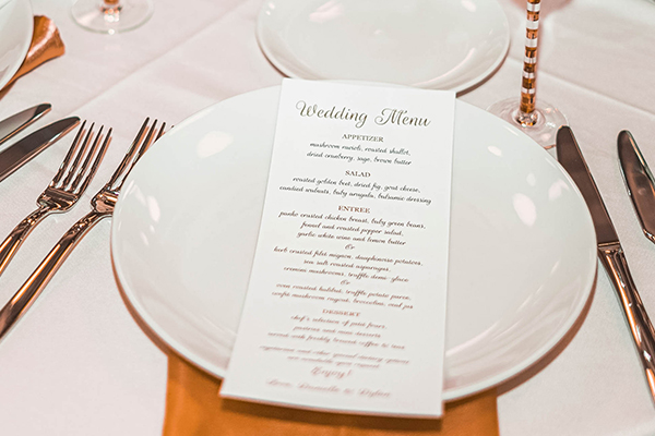 wedding menu on top of white plate