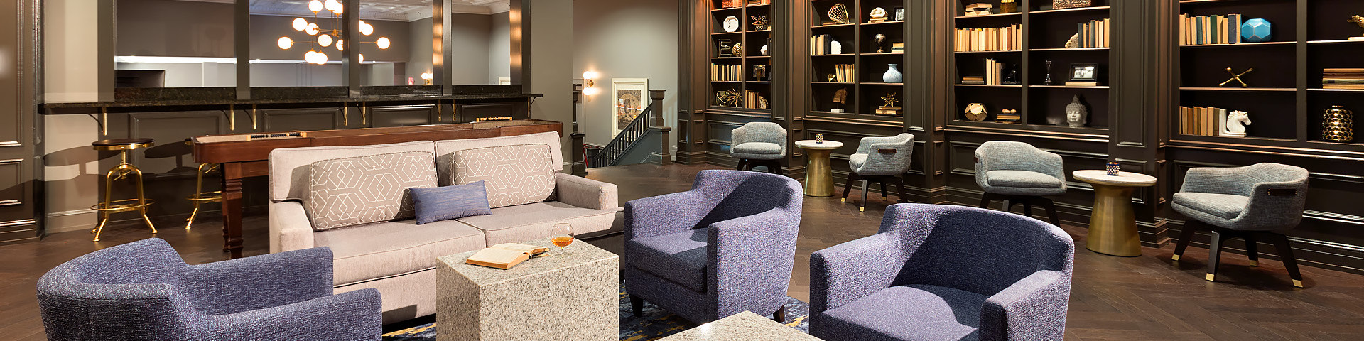 lobby area with multiple chairs and couches