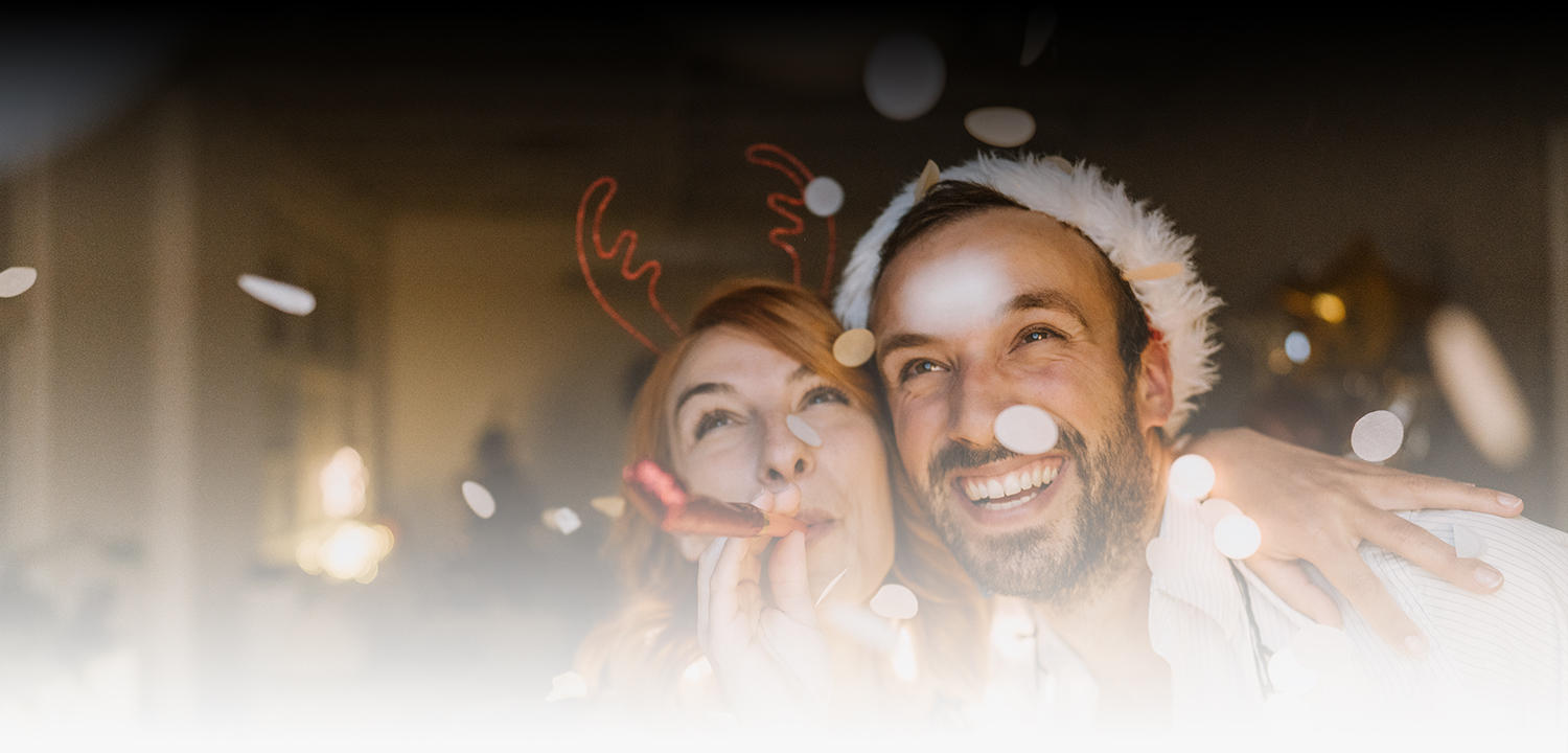 two friends celebrating with fun christmas headbands