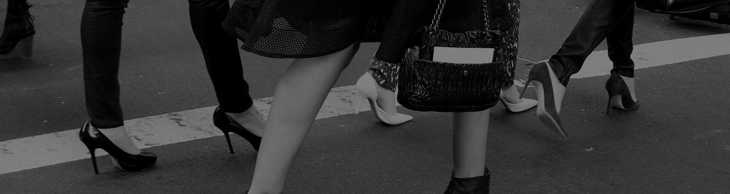 people walking through a street