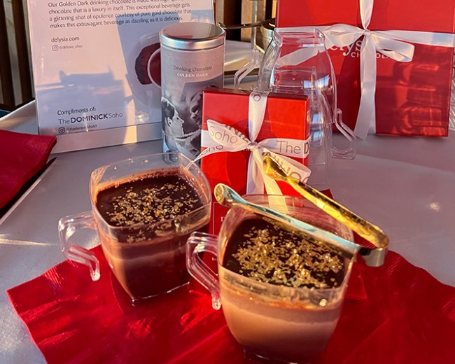 two chocolate drinks with red gift boxes