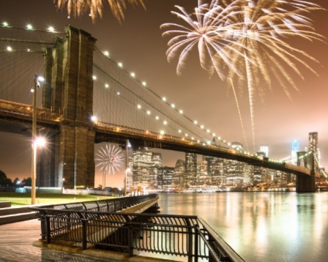 fireworks for a national holiday over the brooklyn bridge