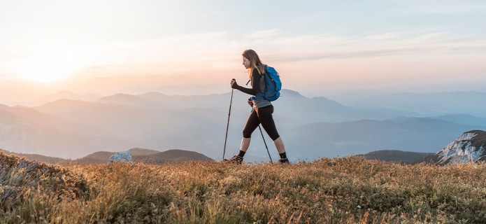 a woman hiking in a mountain