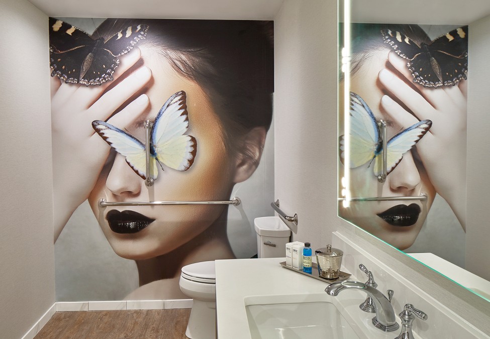 closeup view of the washroom of  property with a unique wall painted 