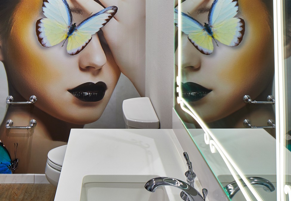 closeup view of the washroom of  property with a unique wall painted 