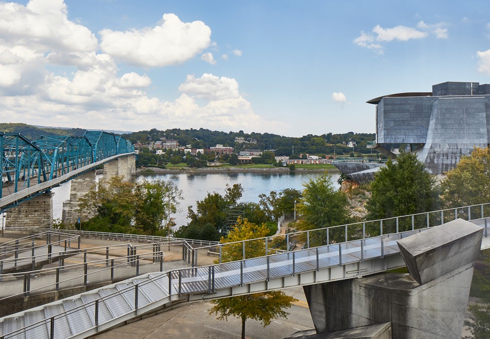 panoramic view of a city and a blue bridge during the day 