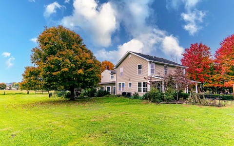 View of a lovely big house surrounded by trees on autumn season
