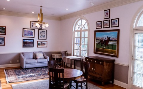 Internal view of a social area with horse pictures 
