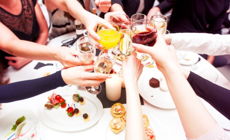 friends cheering with glasses of wine