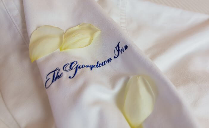 close up of silk robe with Georgetown Inn written on it