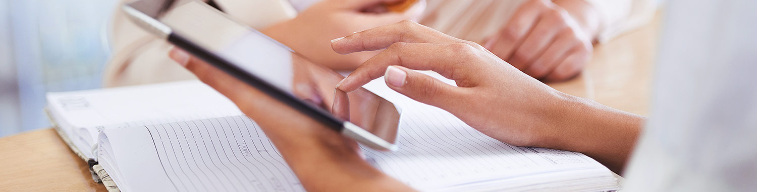 Woman holding resume and iPad