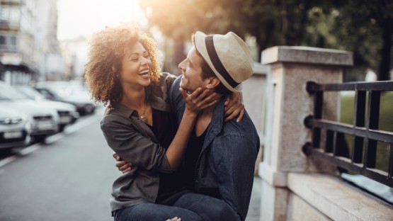 couple enjoying themselves in the street with sunset