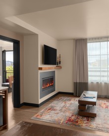 Suite with couch and fireplace