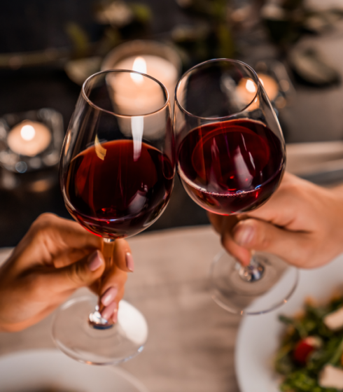 couple toasting with red wine