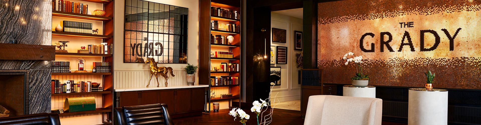 grady sign in lobby with bookshelf and chairs