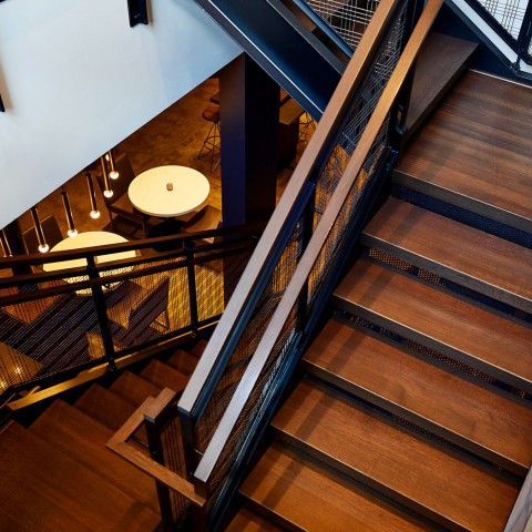 stairs in hotel leading to a seating area
