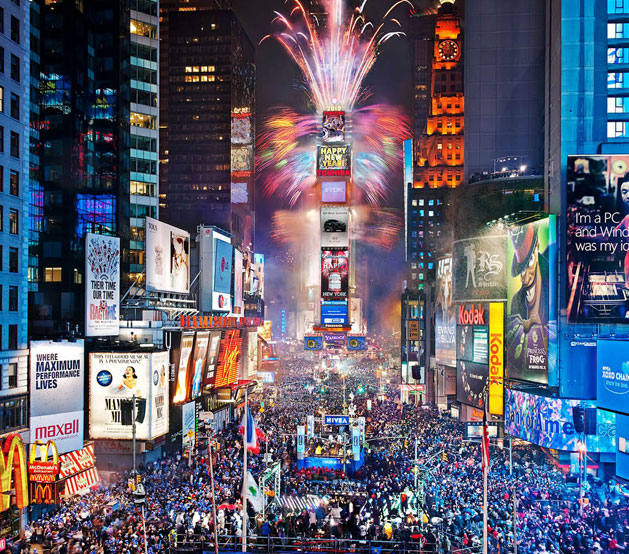 Lit up Times Square with streets full of people during New Years Eve