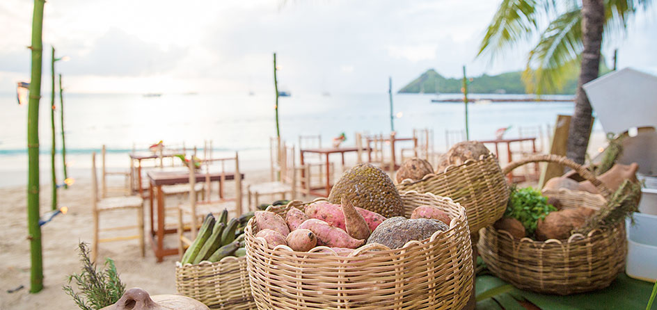 baskets of food with the ocean and island in the background
