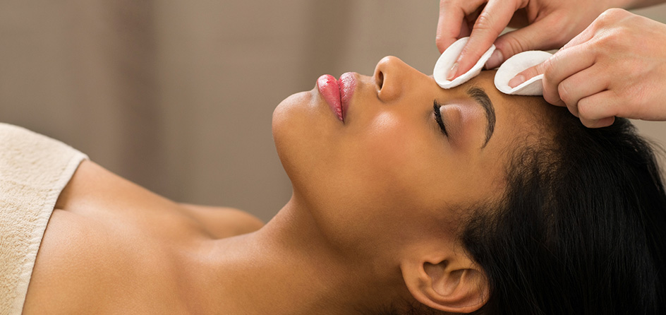 Woman receiving a facial at the salon