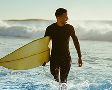 man coming out of the ocean