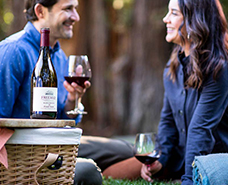 couple enjoying glasses of red wine