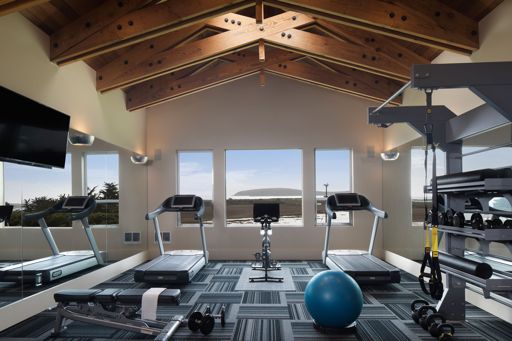 large fitness room with a nice view 