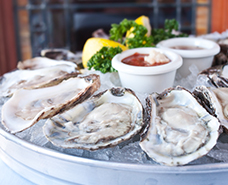 shucked oysters on an ice tray