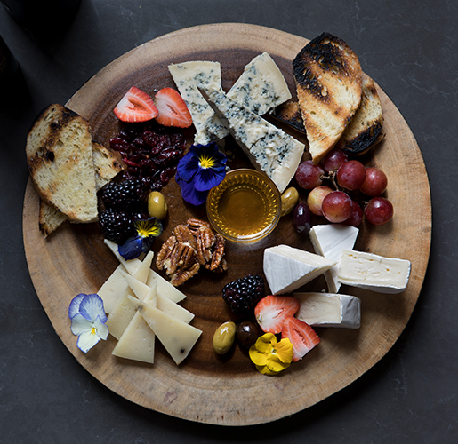 charcuterie board with flowers
