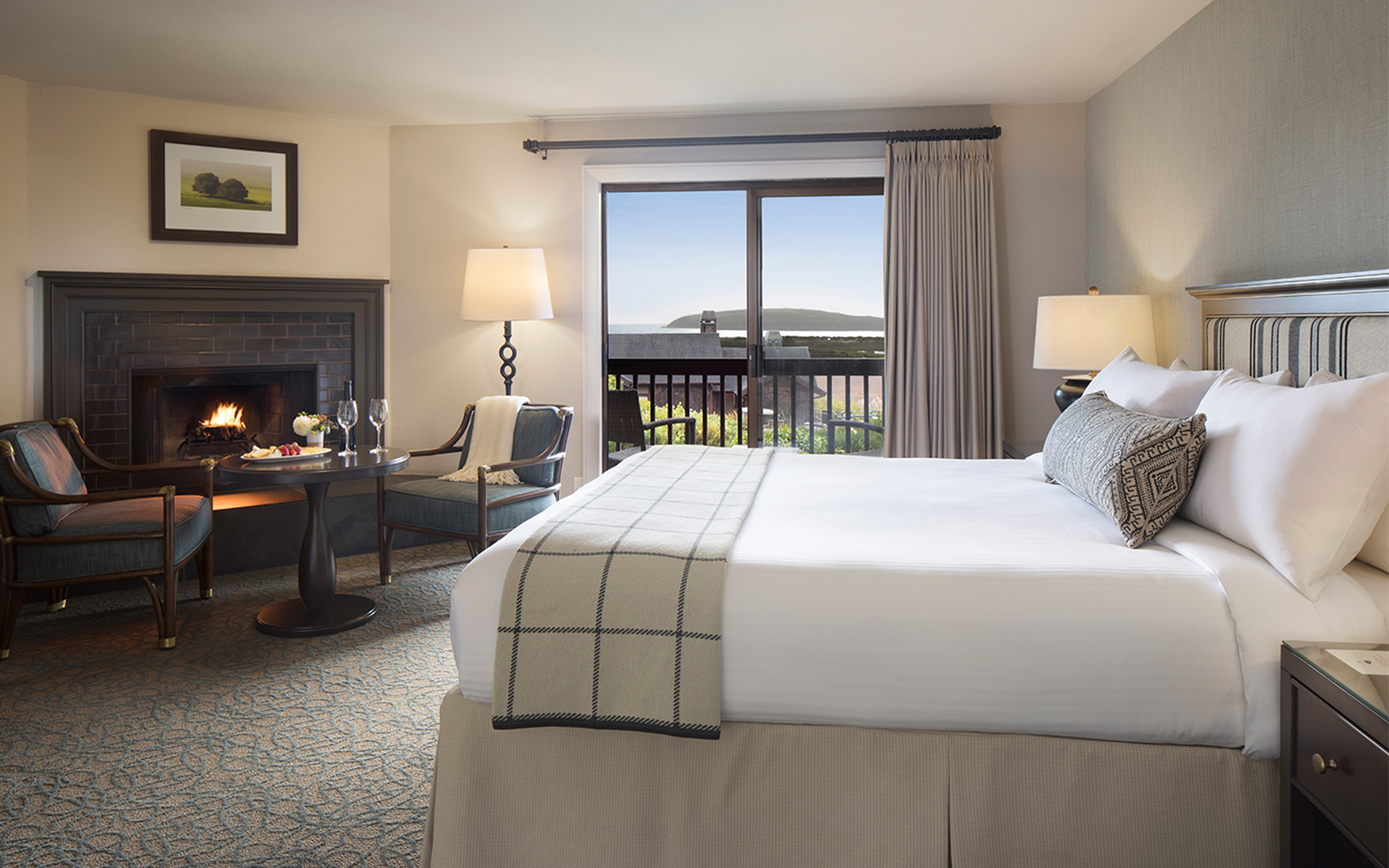 hotel room with a large bed and ocean views
