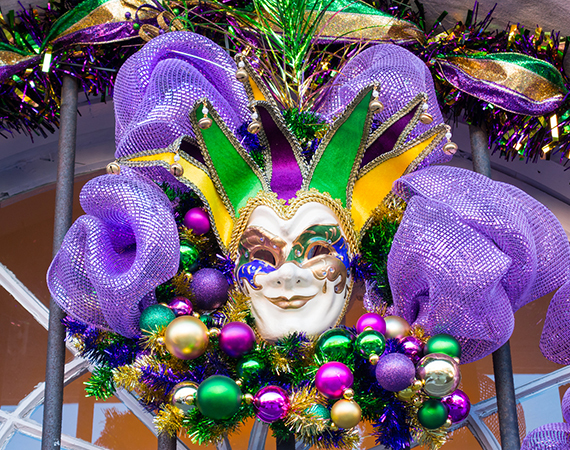 mardi grass masquerade with fun decoration behind
