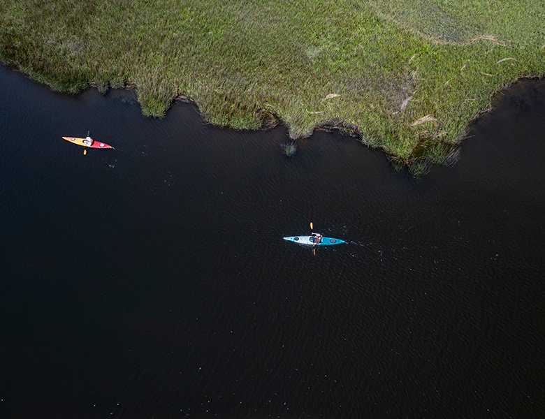two kayaks in canal