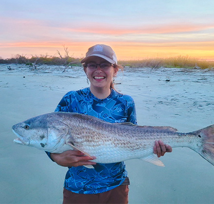 naturalist alli smith holding large fish