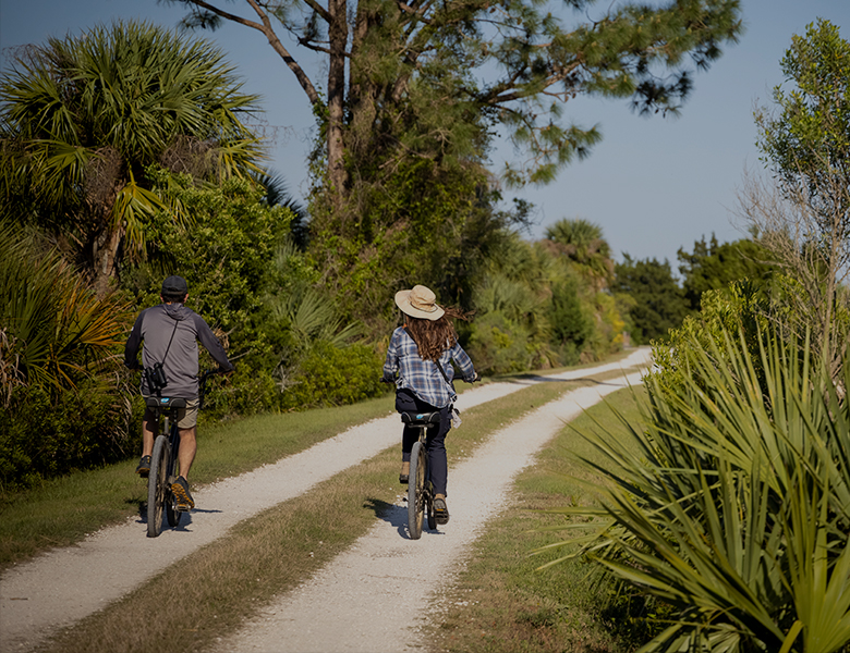 couple biking on trail
