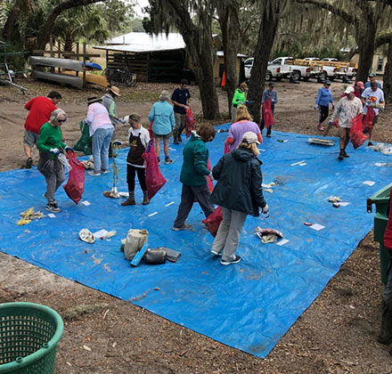 people sorting collected items