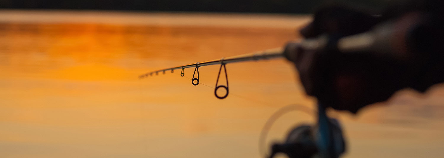 fishing line in water at sunset 