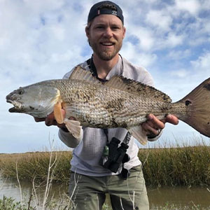 man holding a large silver fish