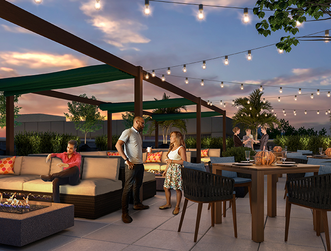 people talking and sitting on the rooftop patio decorated with lights and modern seating