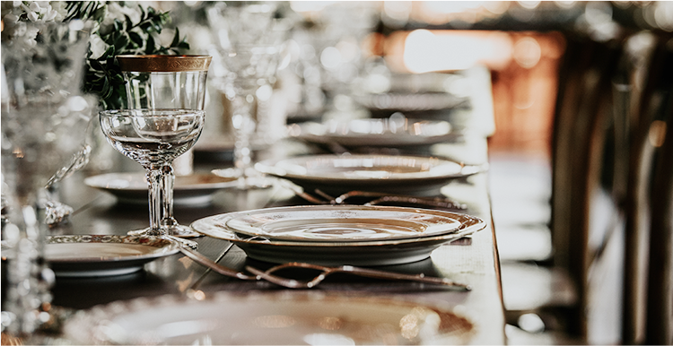 close up view of table settings at a wedding reception table