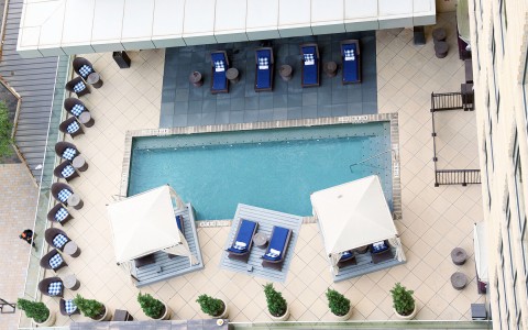 view of the pool and the two cabanas from above